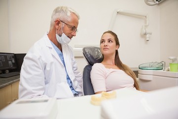 Dentist and patient looking at each other