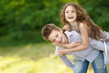 Fototapeta premium Portrait of a boy girl in a summer