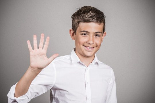Handsome teenager showing 5 fingers palm, number five gesture