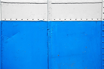 close up old blue and white metal wall