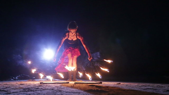 Artist turns the fiery fire-snakes fire performance