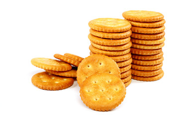 Stack of cracker biscuits on a white background.