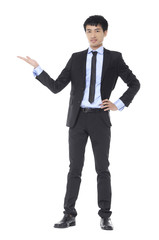 Young business man with arm out in a welcoming gesture