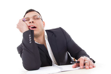 tired businessman sleeping at work yawning