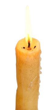 burning stearin candle close up isolated on white
