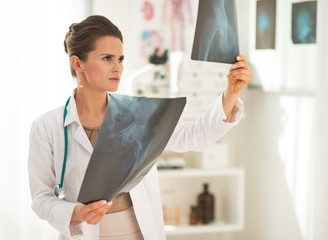 Doctor woman looking on fluorography