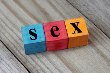 sex word on wooden colorful cubes