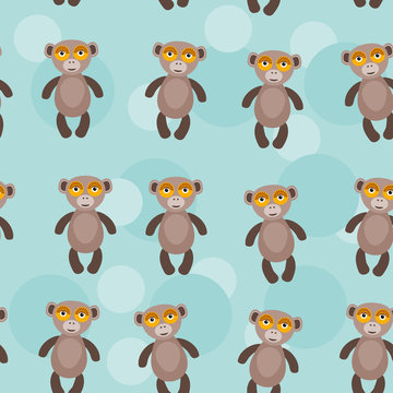 Seamless pattern with funny cute monkey animal on a blue backgro