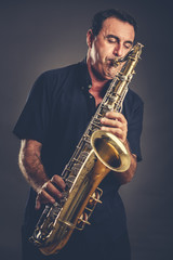 Plakat musician with saxophone