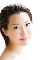 Fototapeta premium Beautiful asian girl smiling on white background