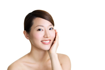 Beautiful asian girl smiling touching face on white background
