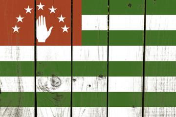 Abkhazia flag on wooden background