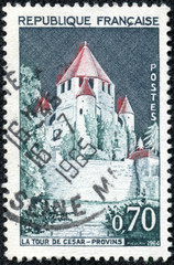 stamp printed by FRANCE shows view of the Caesar Tower