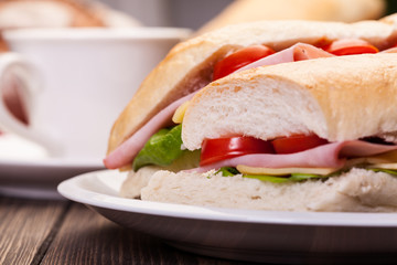 Panini sandwich with ham, cheese and tomato