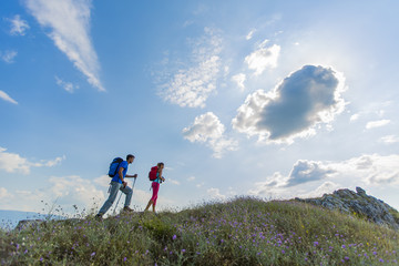 Young couple hiking on the mountain