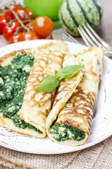 Mediterranean cuisine: crepes stuffed with cheese and spinach