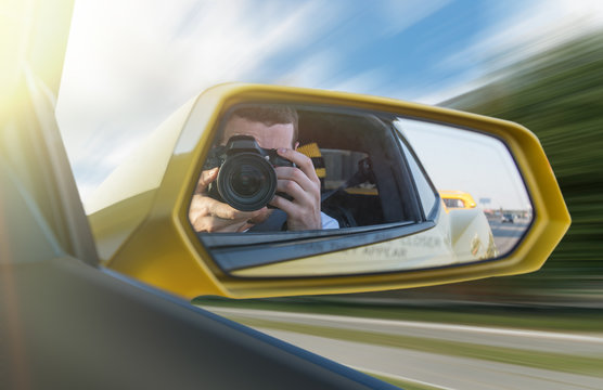 Photographer In A Car