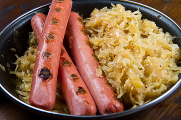  roasted wurstel with  sauerkraft and beer