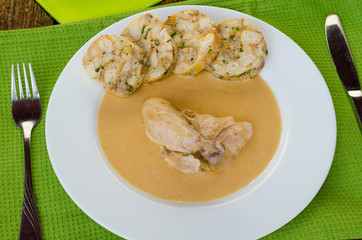Chicken in cream sauce with dumplings