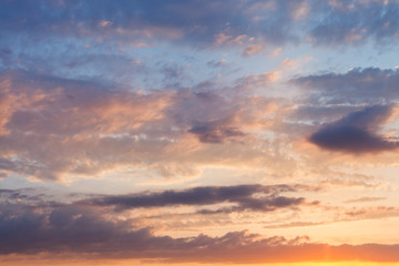 Fototapeta na wymiar pink clouds in blue sky at sunset
