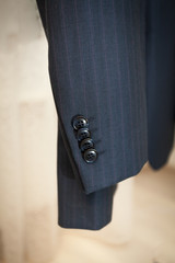 photo of male jacket sleeve with buttons