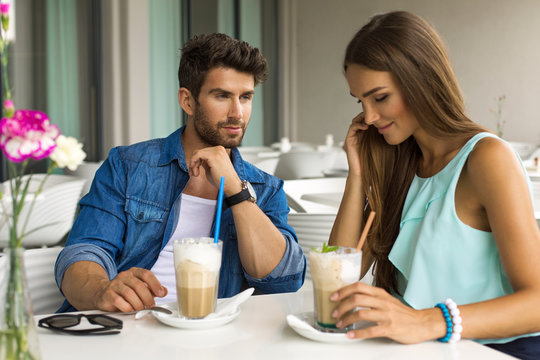 Young couple in love drinking coffee