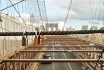 duff lock hanging on the rail of brooklyn bridge, nyc, usa