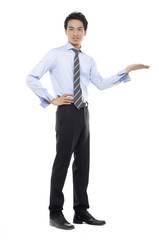 Young business man with arm out in a welcoming gesture