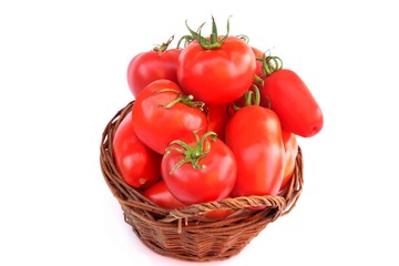 Different Ripe Tomatoes in wicker basket