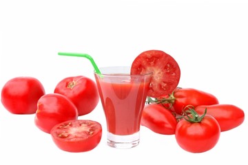 Tomato Juice in glass and ripe tomatoes