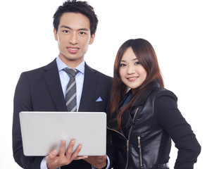 young asian business couple with laptop posing