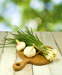 image of green onions and garlic on the board