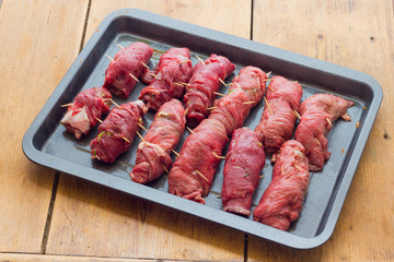 beef rolls stuffed with bacon ready to be cooked
