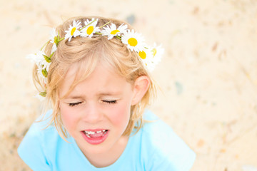Pretty Little Blond Girl with a Crown of Daisies