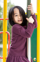 Little asian lady on a playground