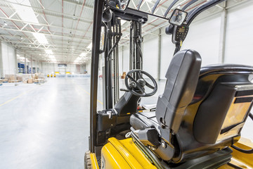 Forklift truck ready to use in modern storehouse