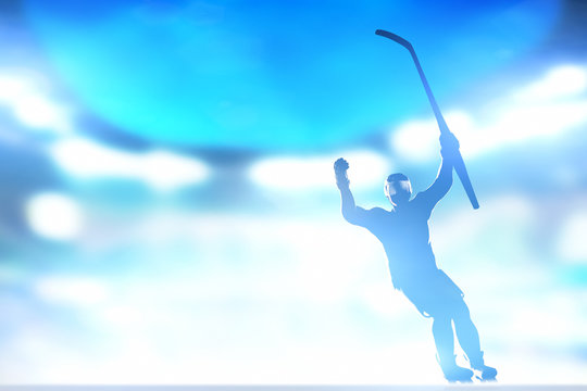 Hockey player celebrating goal, victory with hands and stick up