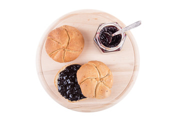 bread spread with jam arranged on kitchen board