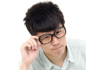 handsome young man holding glasses against white background