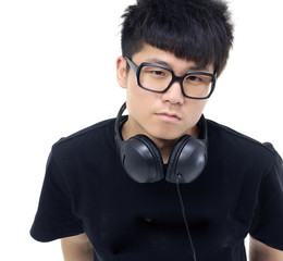 Portrait of a young man in sunglasses with headphones.