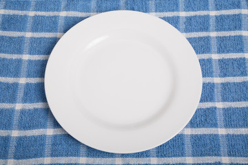 Empty Plate on Blue Towel