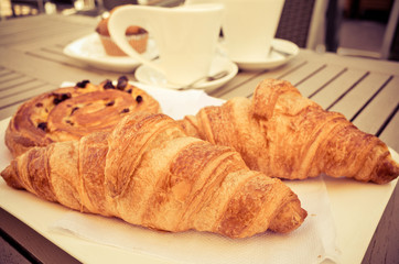 coffee and croissants on table