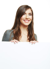 Smiling woman leaning on big blank board . Close up female face