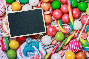 Fototapeta na wymiar blackboard for writing greetings on a lollipop and sweets