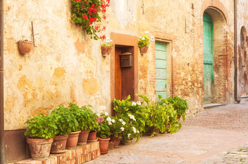 Fototapeta na wymiar Sunny streets of Italian city Pienza in Tuscany