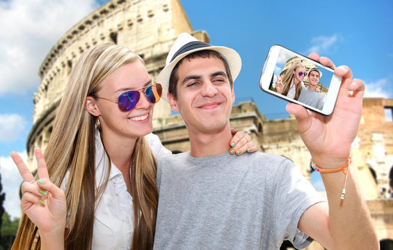 Selfie - Romantic travel couple by Coliseum
