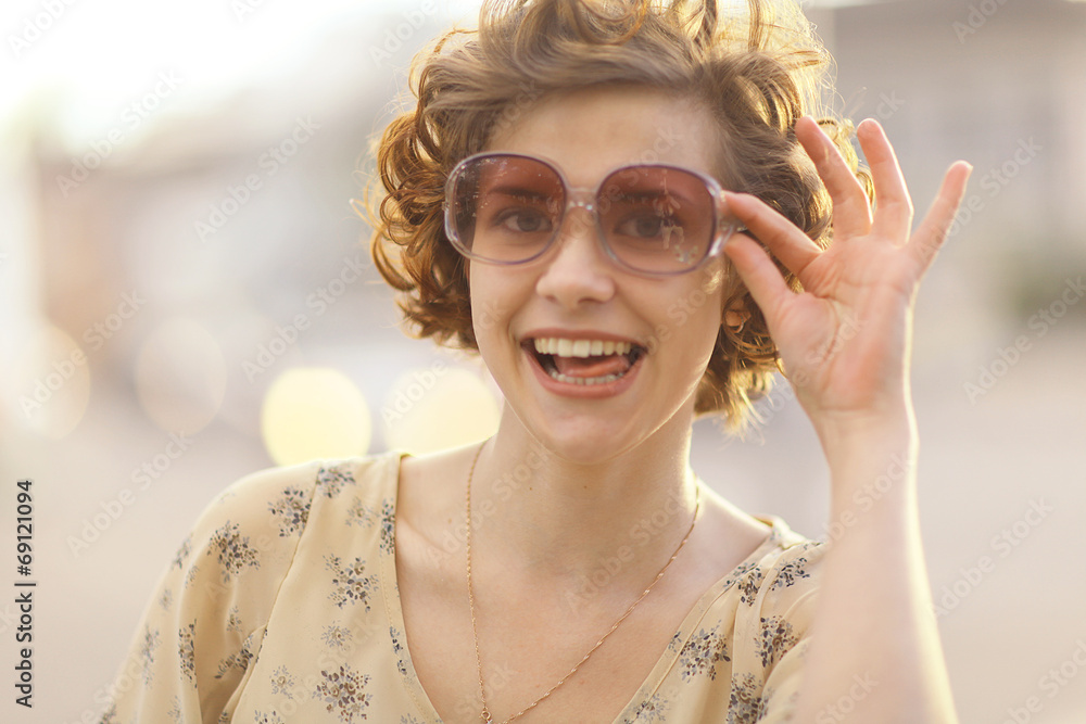 Wall mural summer portrait of a cheerful girl