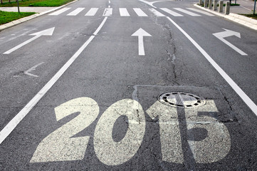 Road to new year 2015 with arrows in the background