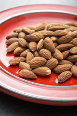 Raw almonds in plate