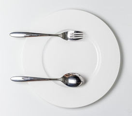 Fork and Spoon on White dish
